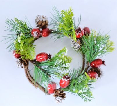 22079 -  Wintery wreath with a display of snowy pine needles, cones and large frosted berries. Floral decoration.  Size   Approx 23cm diameter