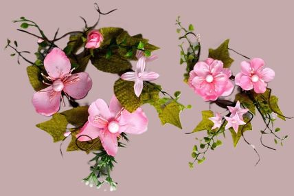 33018 - Delicate Pink Flowers wrapped with vibrant green leaves make these a lovely floral decorative arrangement.  Two  sizes Available 