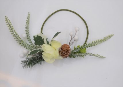 22081 -  Beautiful Cream flower in a wintery wreath with a display of snowy pine needles, cones, berries and green leaves. Floral decoration. Size   Approx 24cm dia