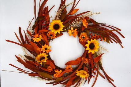 22086 - Large Summer/Autumn hanging wreath. Beautiful floral arrangement of glowing sunflowers entwined with delicate white flowers, berries and soft textures of grass.   Approx Size:  70cm Outer Dia