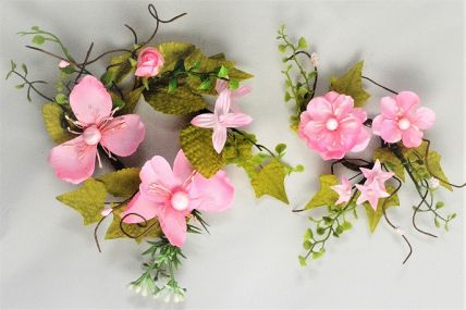 33018 - Delicate Pink Flowers wrapped with vibrant green leaves make these a lovely floral decorative arrangement.  